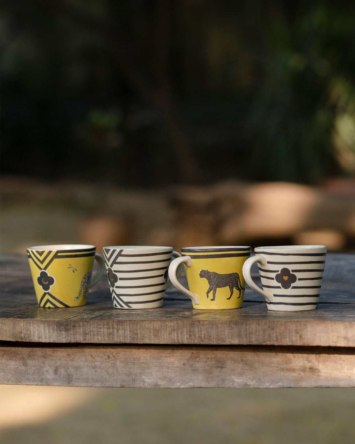 Chand Espresso Mug set of four in yellow and striped designs.