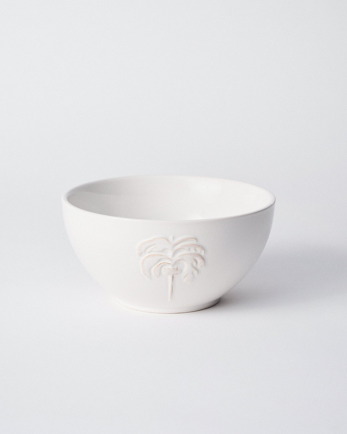 Side view of Ele Palm Serving Bowl showing an embossed palm.