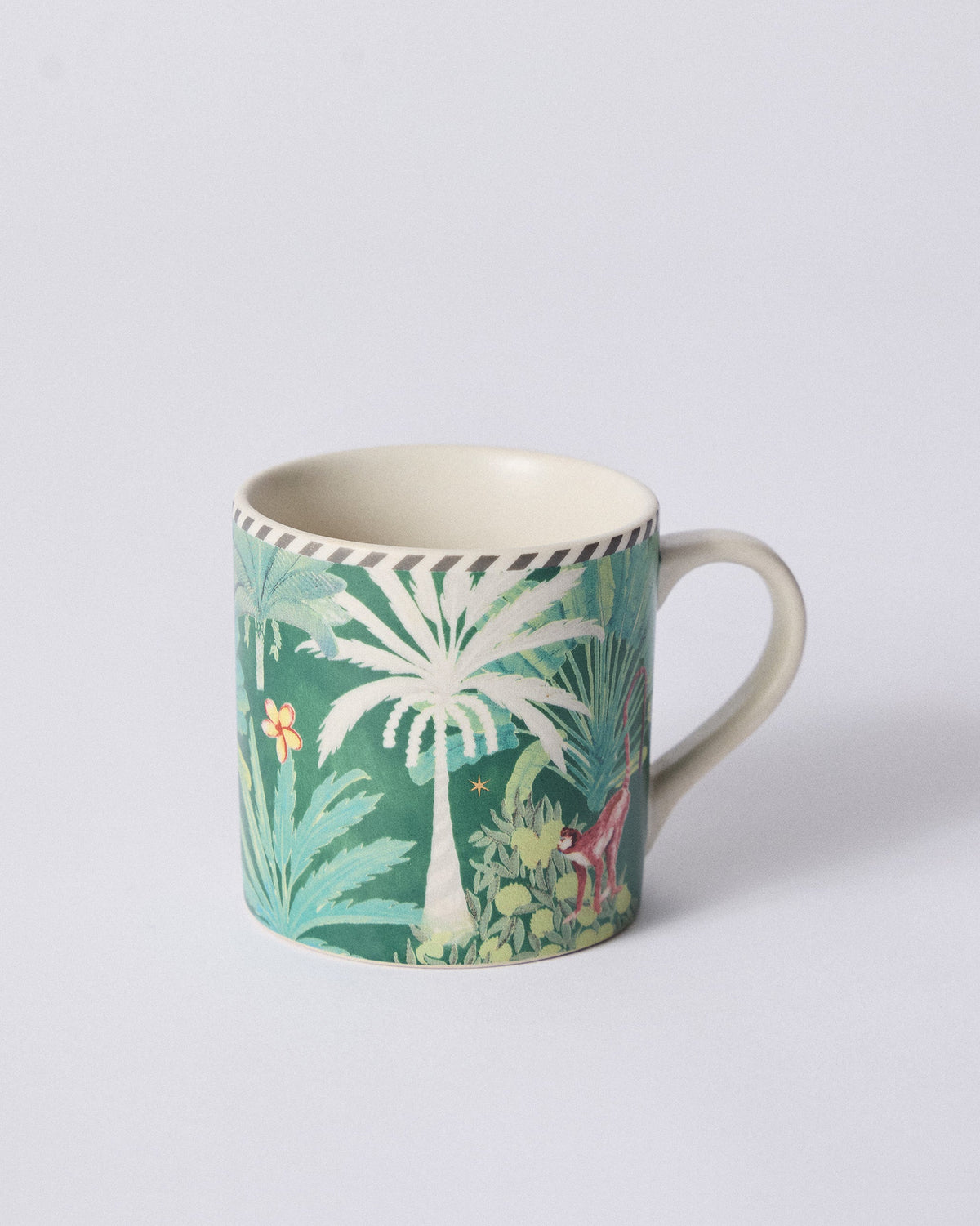 Side view of Ceylon Trail Straight Mug with palm trees and a green jungle print.