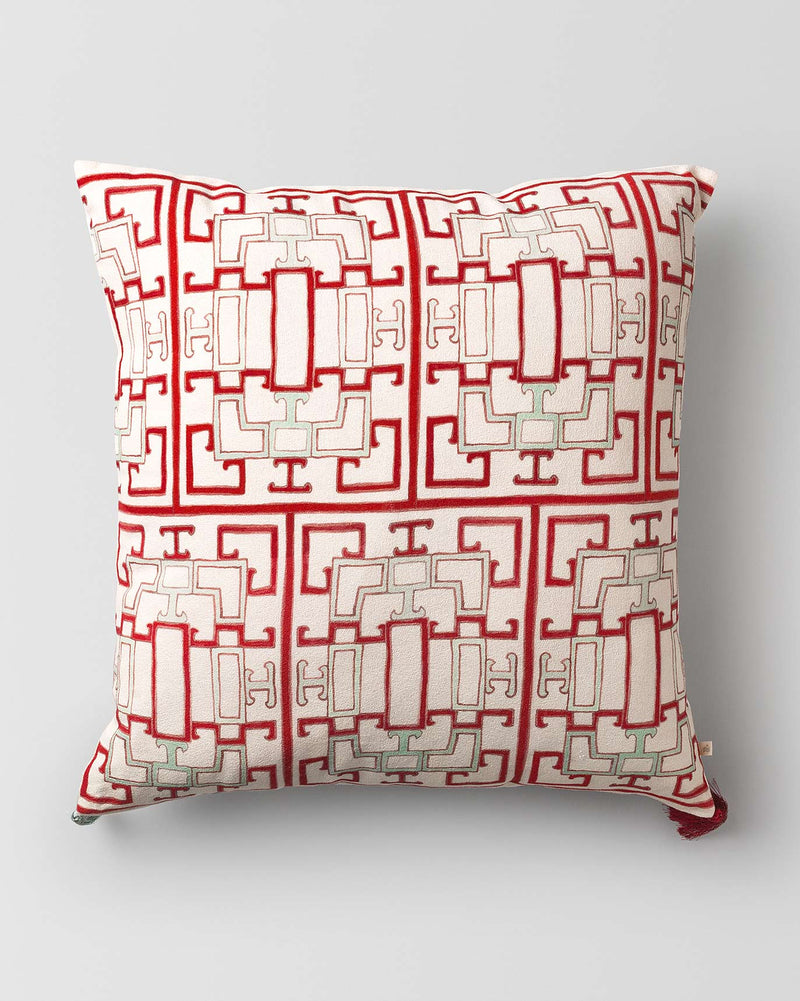Red and cream Chi Cushion Cover with a geometric pattern.