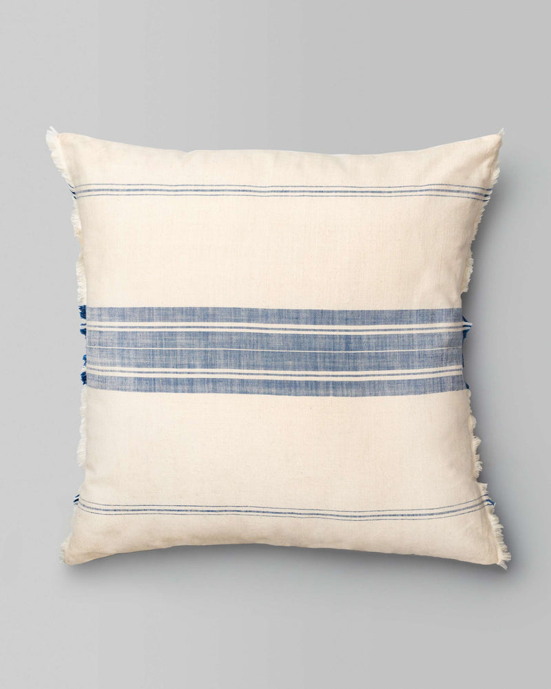 Kemuri French Stripe Cushion Cover in cream with blue stripes and fringed edges.