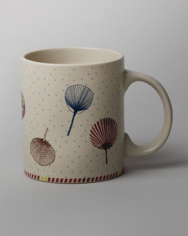 Side view of the Kaze Wind Mug showing fan-leaf motifs and a handle.