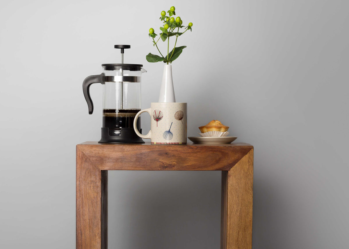 Kaze Wind Mug on a wooden side table.