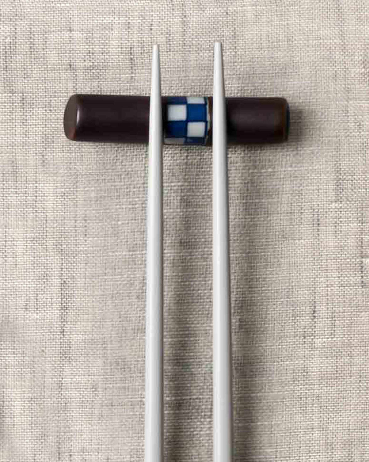 Close-up of the Checkered Chopstick Rest showing its blue and white checked inlay.