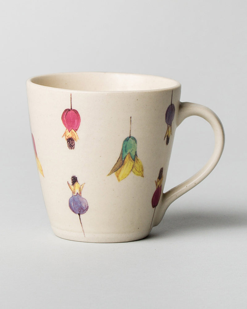 Shunran Mug with hanging flower motifs in pink, green, yellow and purple.