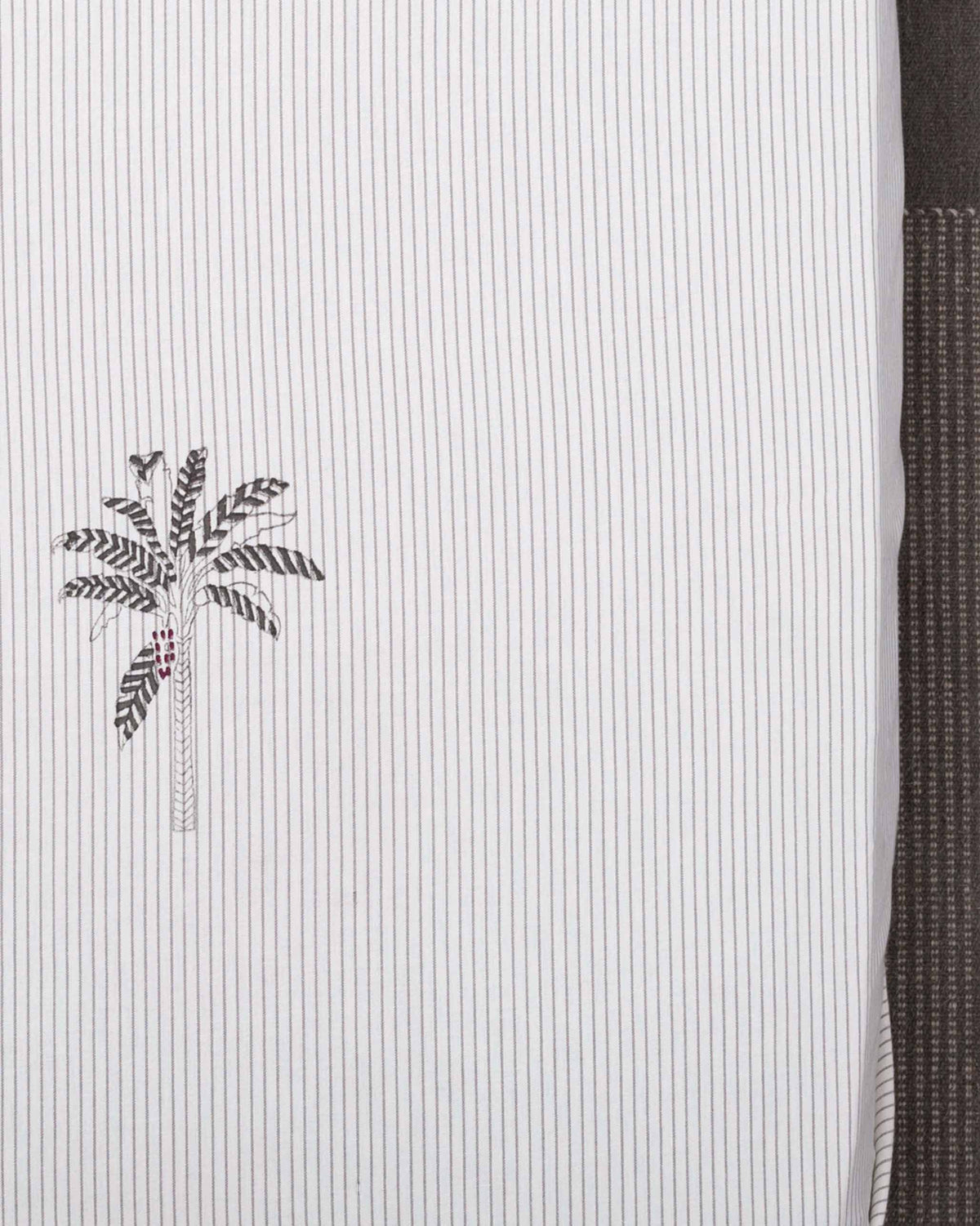 Close-up of Alleppey Printed King Bedcover showing a grey palm tree motif on pinstripes.