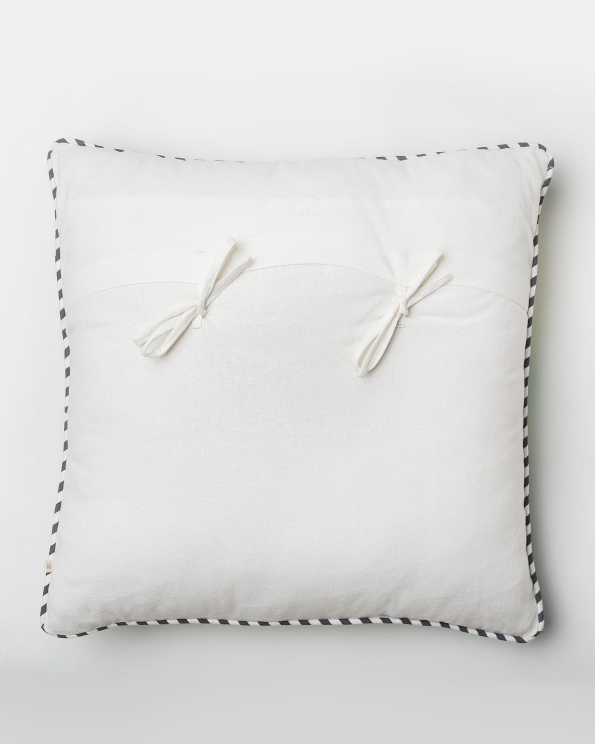 Back of the Banana Leaf Cushion Cover with two tasselled ties.