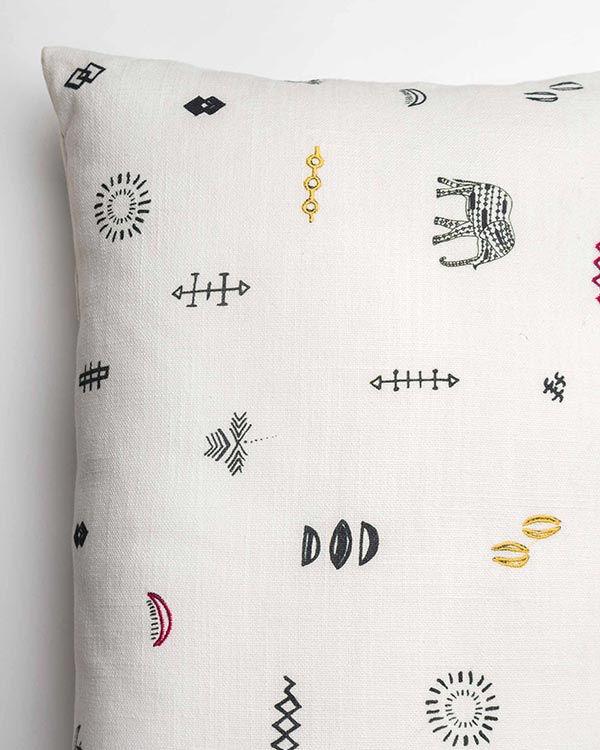 Close-up of the Ceylon pillow cover showing an embroidered elephant and small motifs.