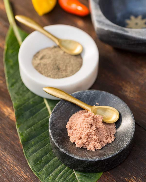 Ceylon Pinch Pot Set holding powdered spices, with gold spoons.