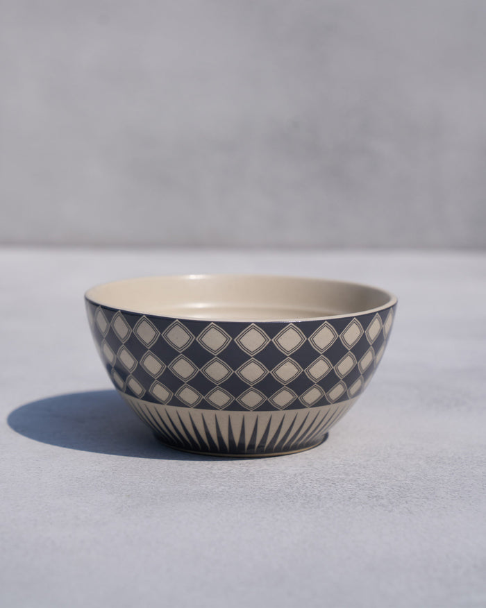 Fez cereal bowl with a navy diamond lattice and cream interior.