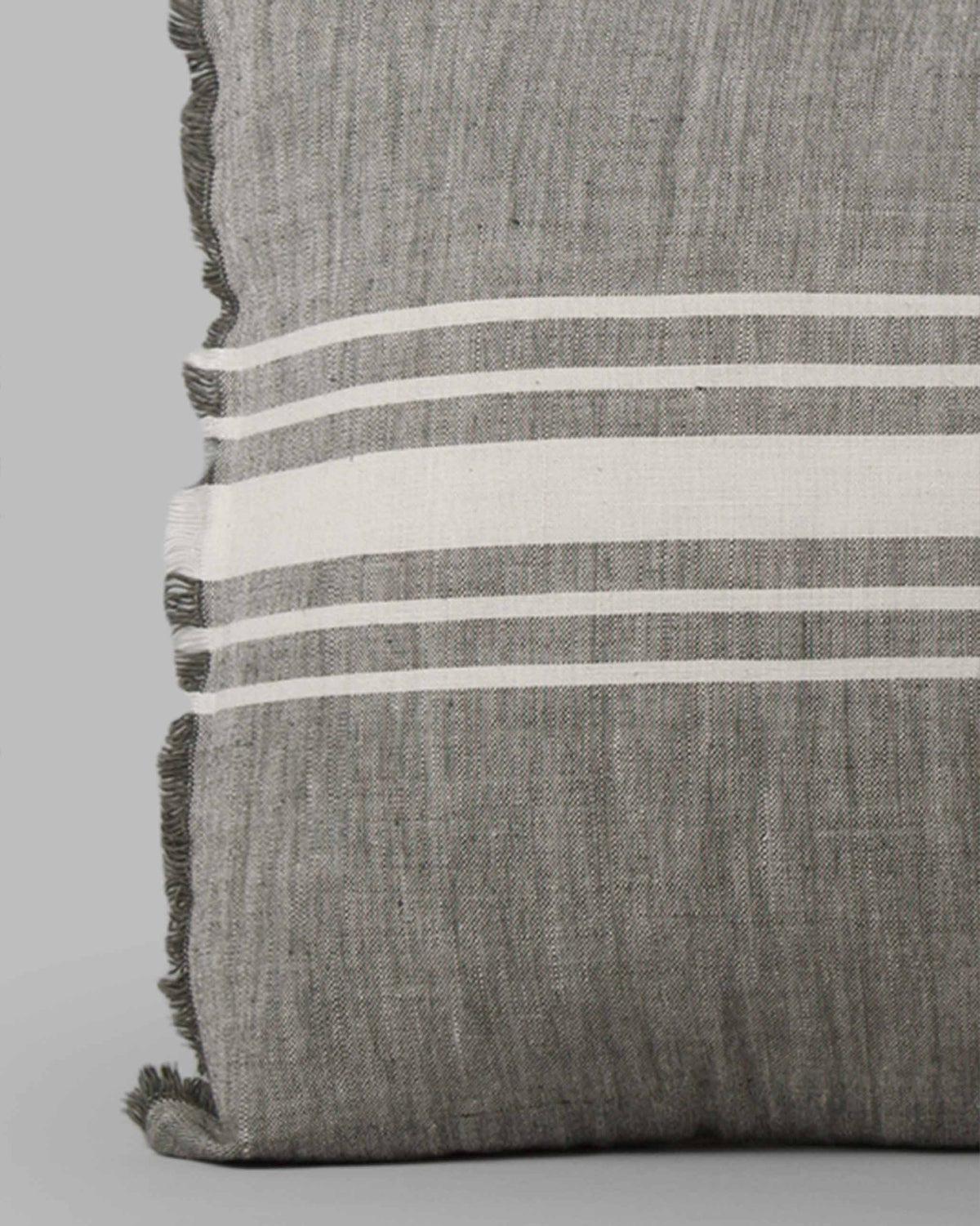 Close-up of Alleppey French Stripes Pillow Cover showing frayed edges and cream stripes.