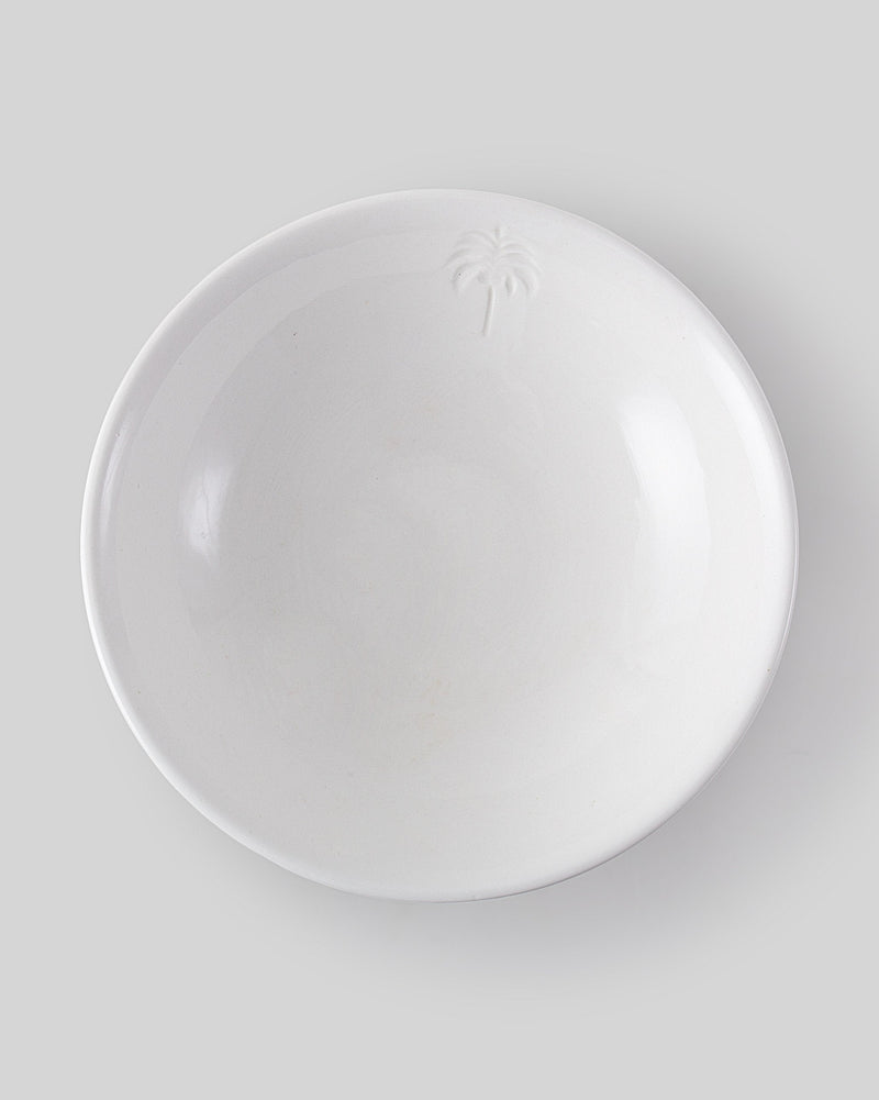 Overhead view of Malabar Vegetable Serving Dish with a raised palm motif near the rim.
