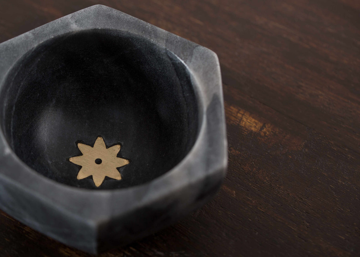 Close-up of the Anise Marble Bowl showing a gold star at the base.