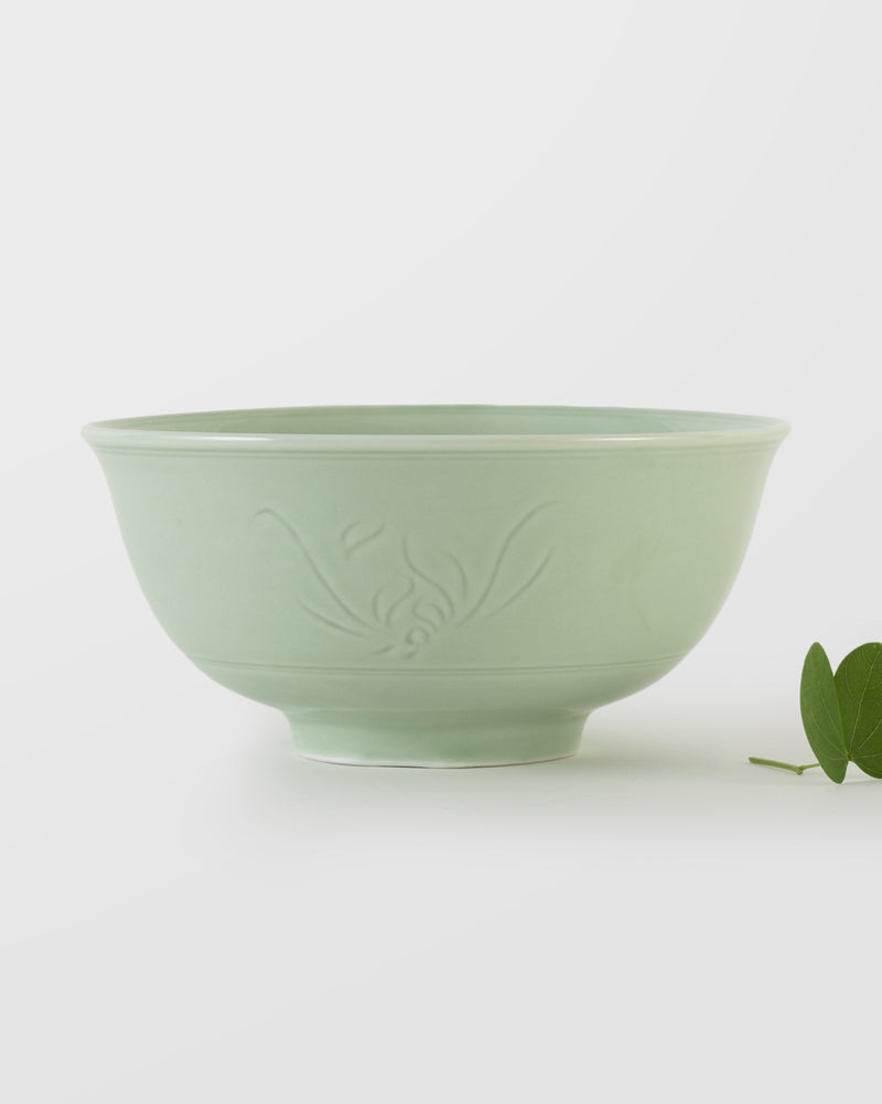 Celadon Noodle Bowl with an embossed leaf motif, seen from the side.