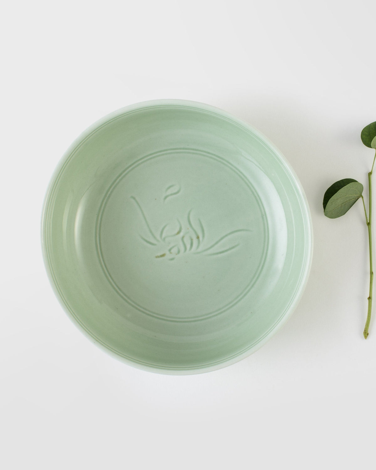 Celadon Nori Bowl seen from above, with an embossed leaf motif at its centre.