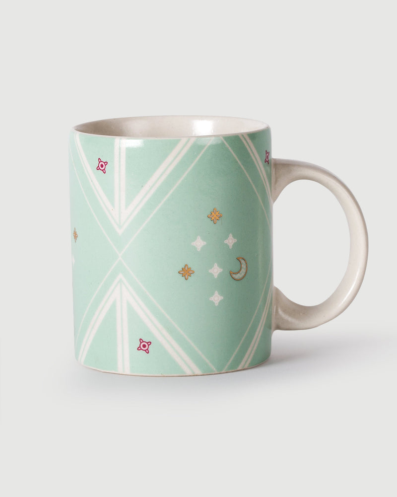 Chand Mug in mint with white diagonal lines and a moon and star motif.