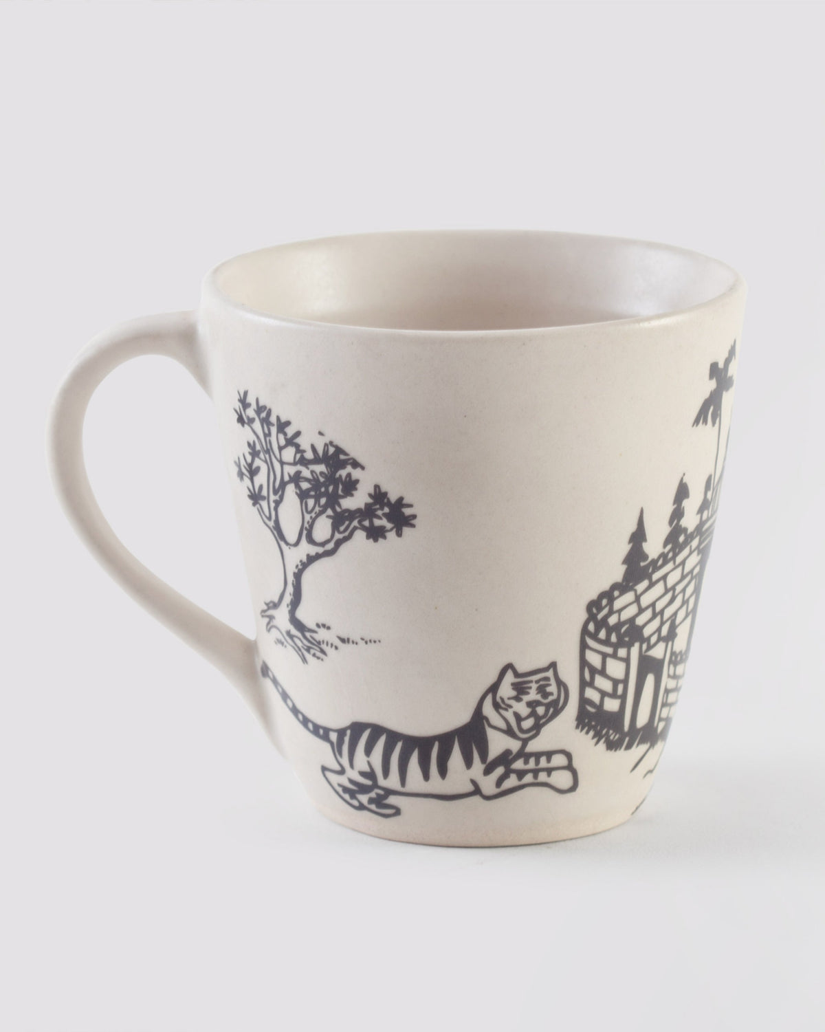 Pazhani Fort Mug with a leaping tiger, a tree and part of a fort.