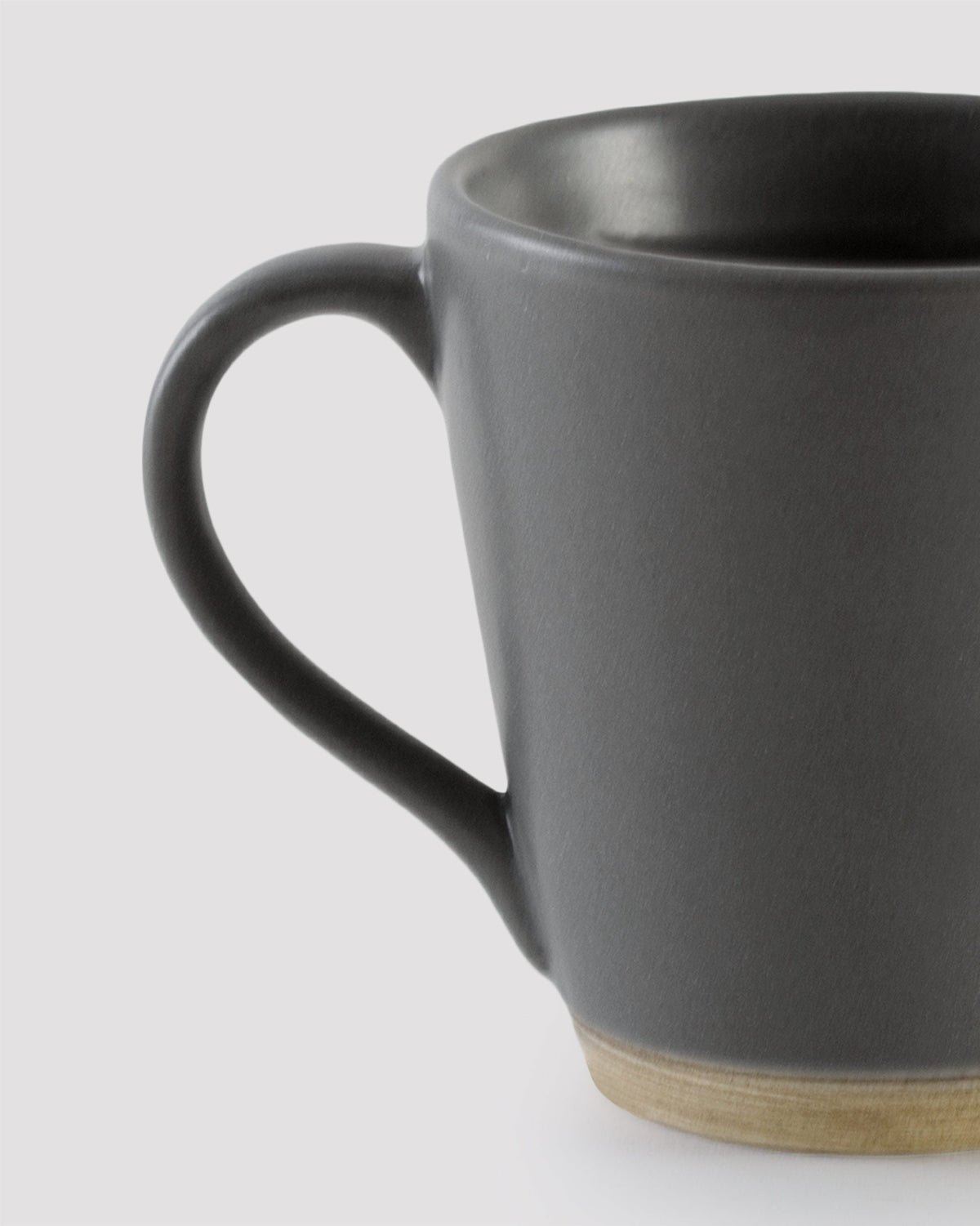 Close-up of Slate Mug handle and matte dark grey body.