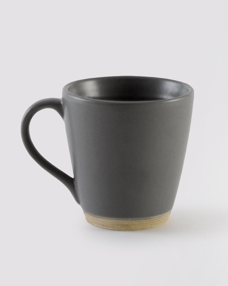 Slate Mug in matte dark grey with a light natural base.