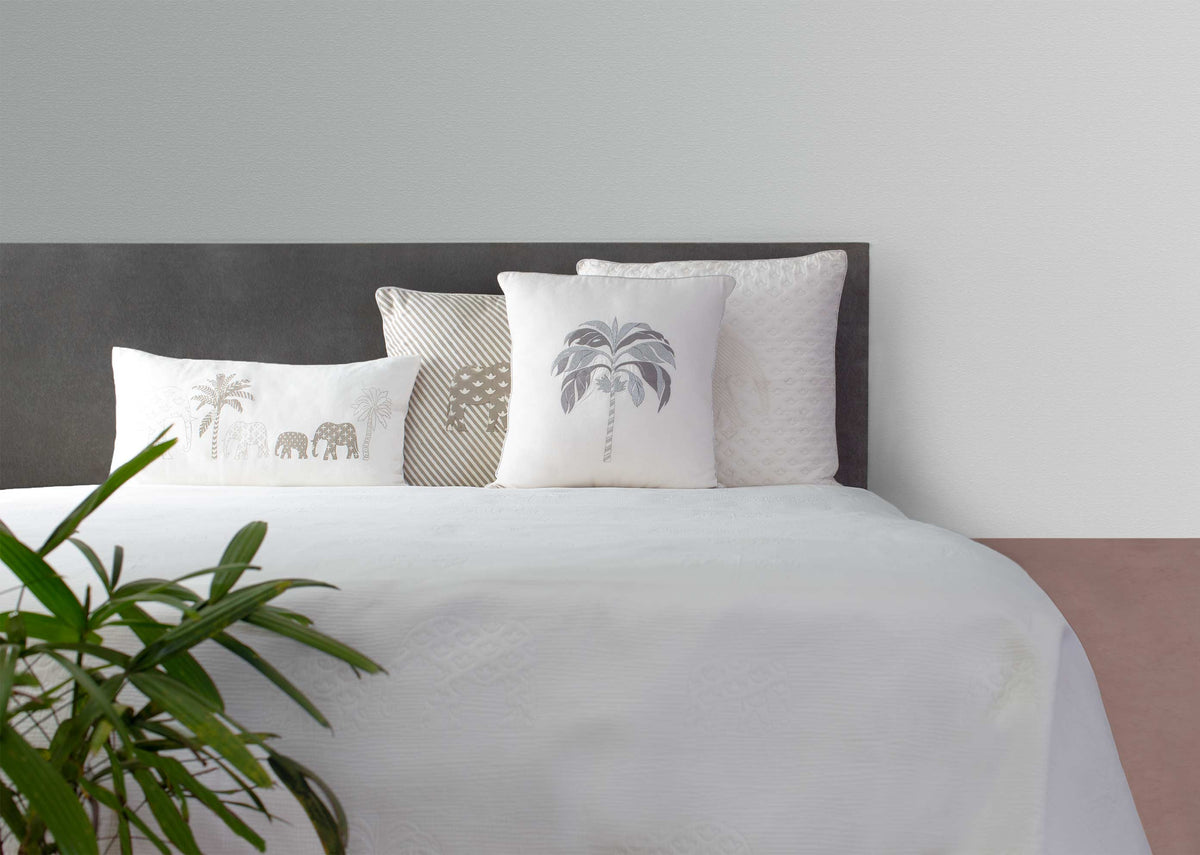 Colombo Matelasse King Bed Cover on a bed, styled with cushions.