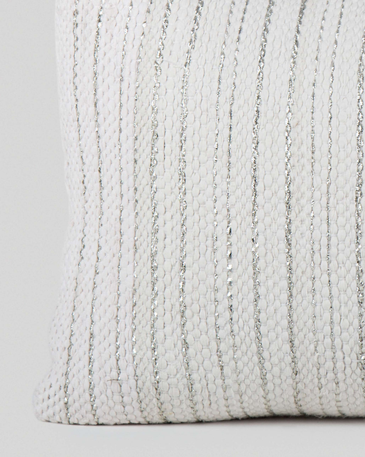 Close-up of a Colombo Classic Textured Pillow Cover showing its woven texture and silver stripes.