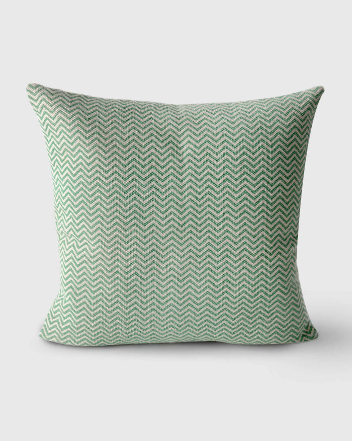 Mahe Chevron Cushion Cover in green and cream chevron pattern.