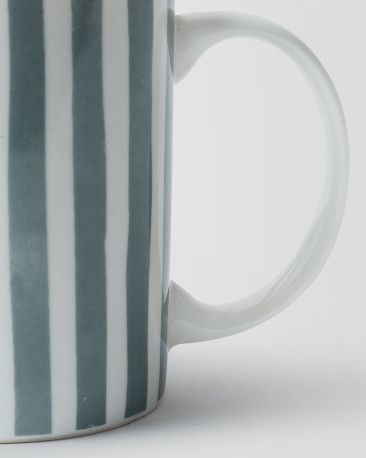 Close-up of Flora Fauna Stripes Mug showing its handle.