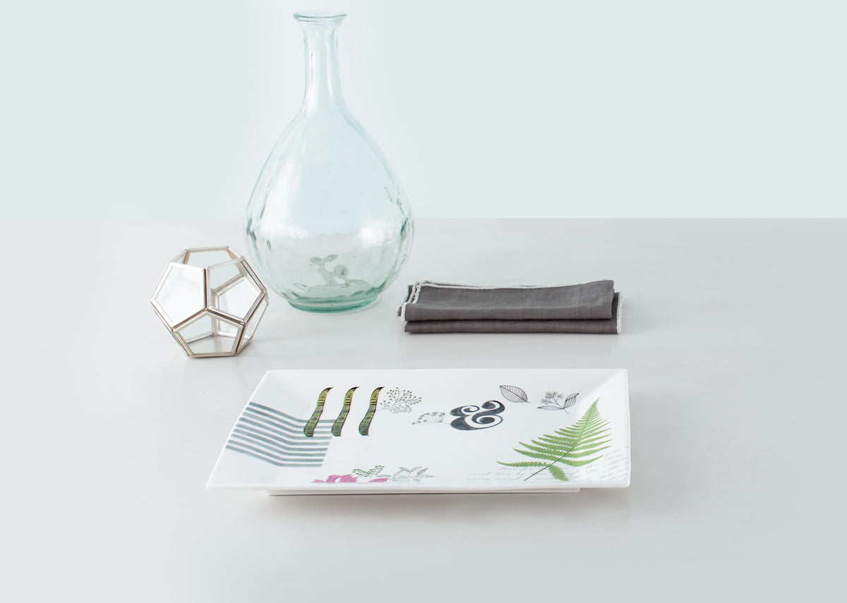Flora Fauna Rectangular Platter set on a table.