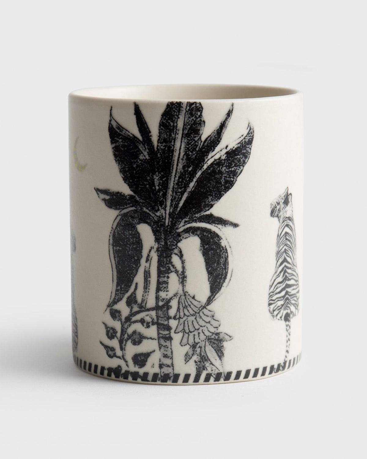 Close-up of the Hathi Mug showing a black palm tree and a striped animal.
