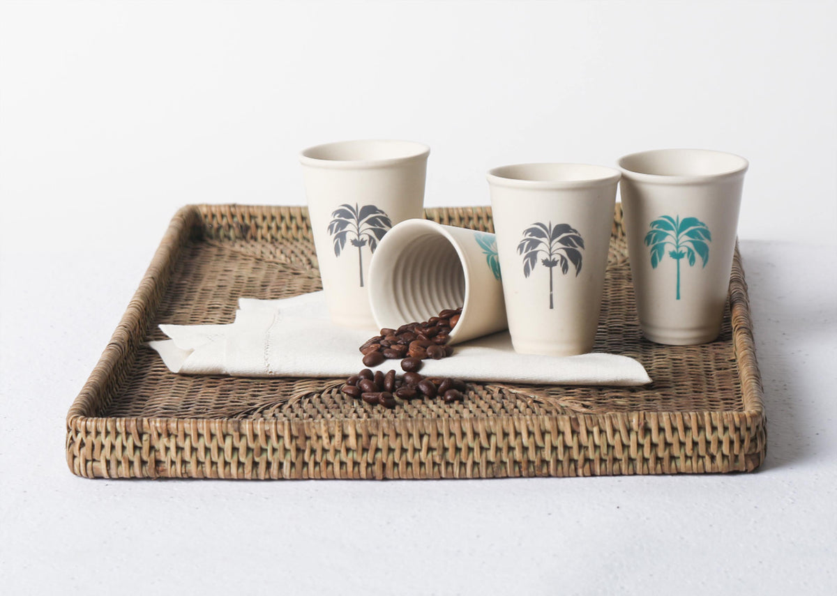 Lotus Aqua Palm Kulhar cups in grey and teal palm designs on a tray.