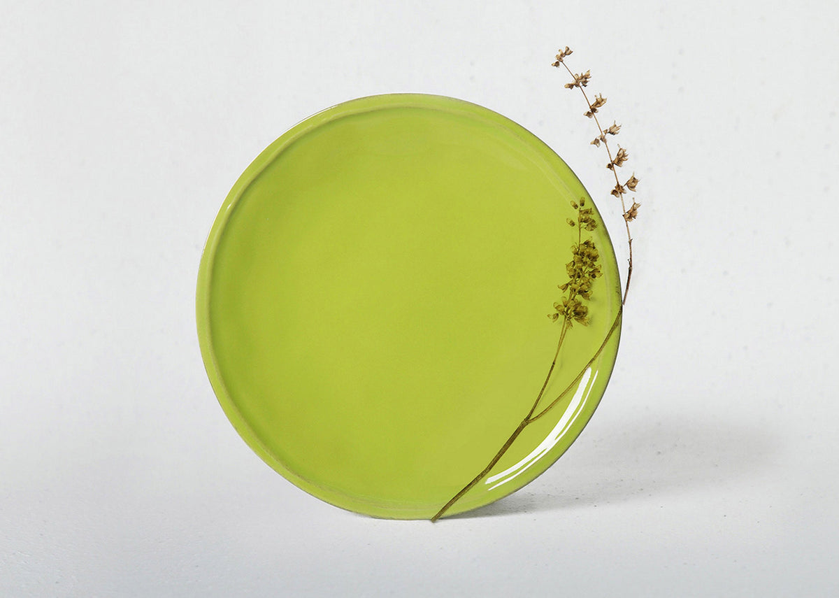 Aguada Quarter Plate in glossy lime glaze, shown at an angle.