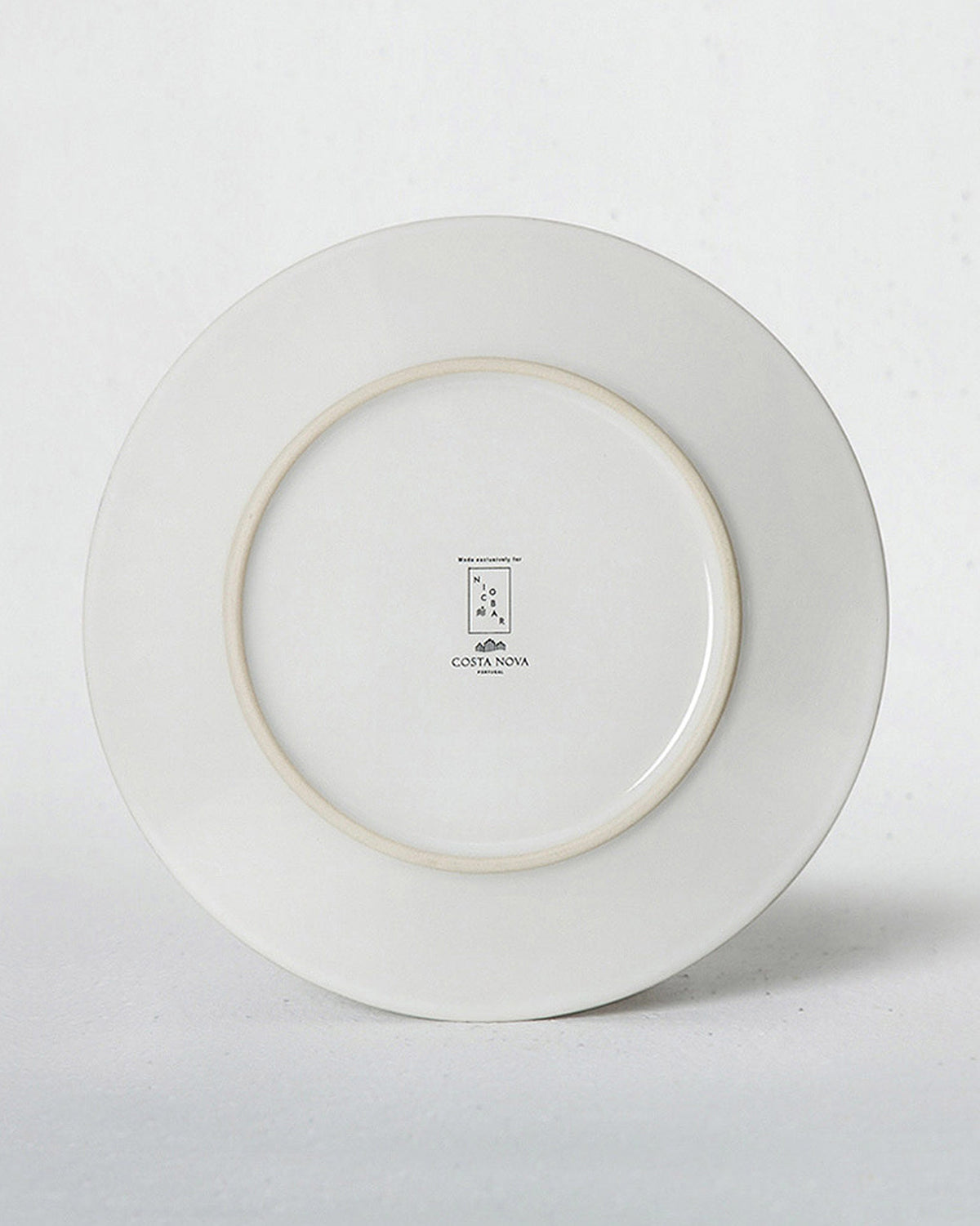 Underside of an Aguada Quarter Plate in white glaze.