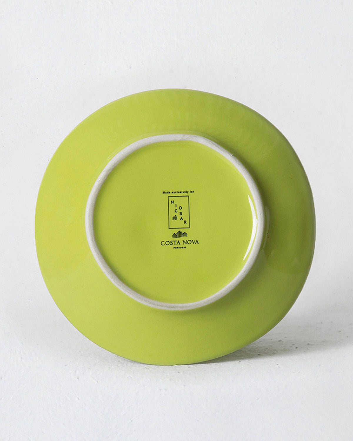 Underside of an Aguada Tapas Plate in lime glaze.