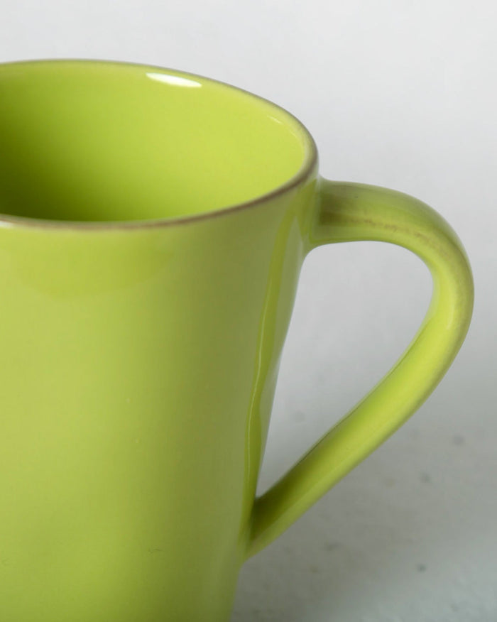 Close-up of the Aguada Mug in lime glaze showing its handle.