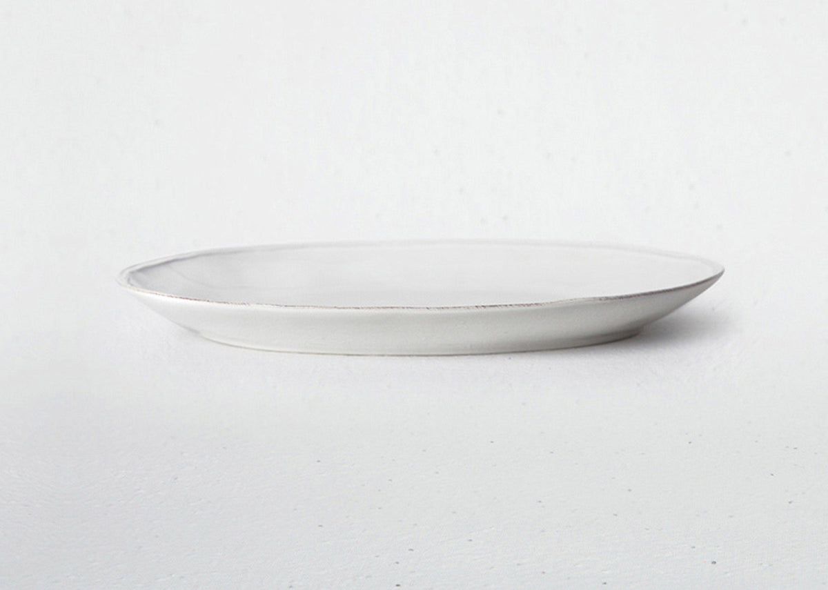 Side profile of an Aguada Oval Platter in white glaze.
