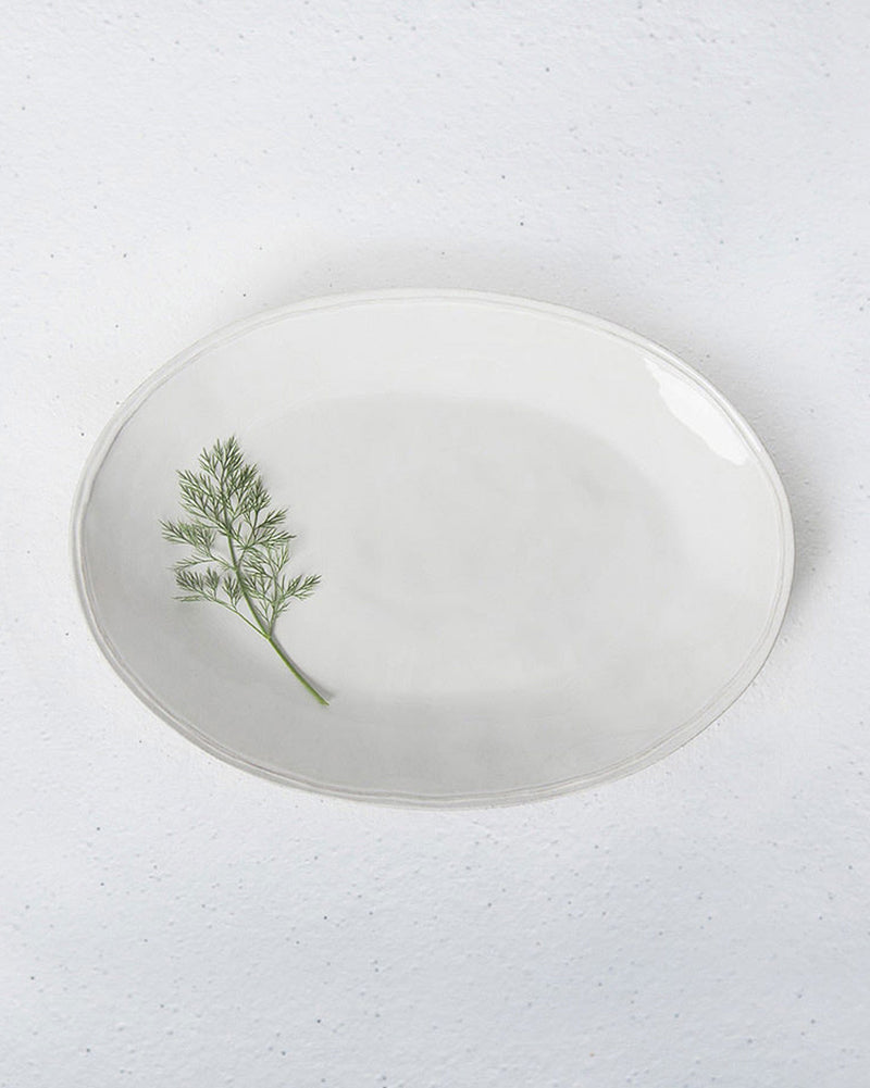 Aguada Oval Platter in glossy white glaze, seen from above.