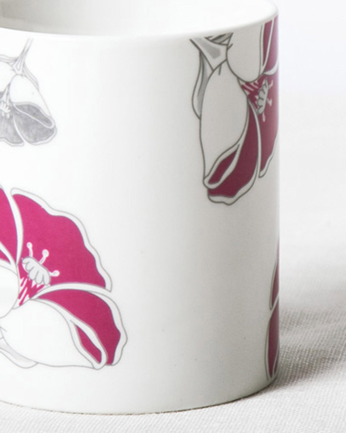 Close-up of Frangi Flower Mug showing a fuchsia bloom with a stamen.