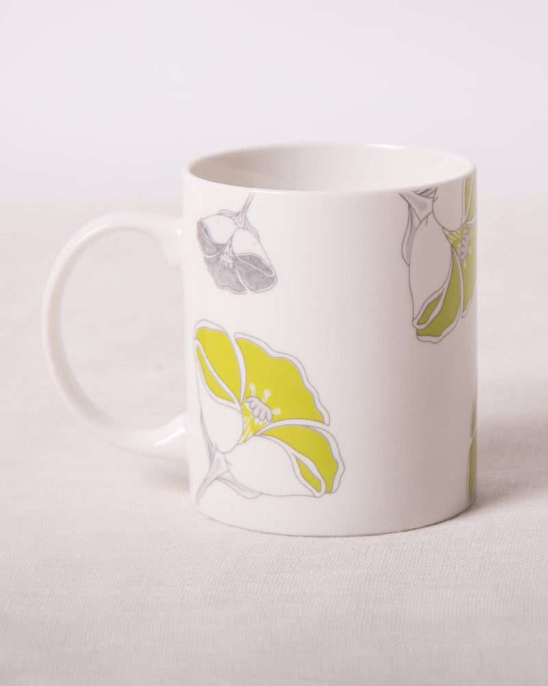 Frangi Flower Mug with lime and grey flower motifs.