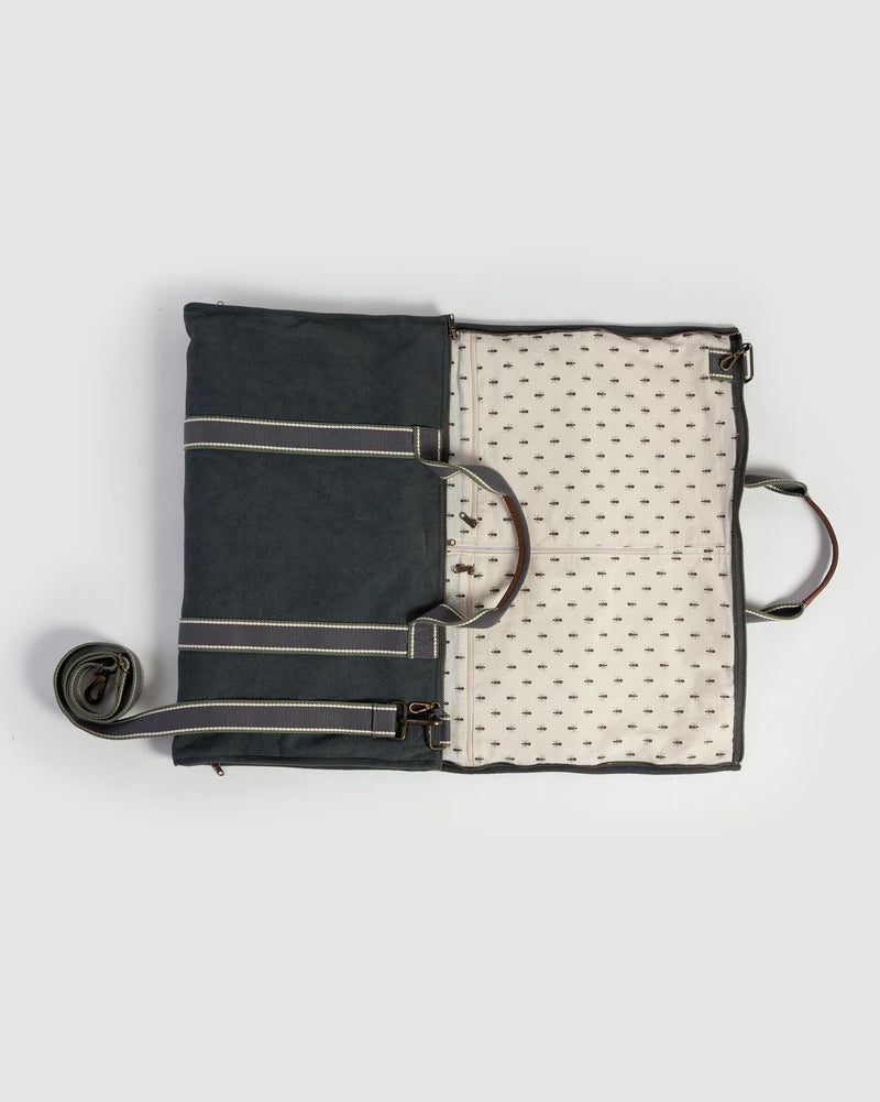 Coat Hanger Bag opened flat, showing the charcoal exterior and patterned cream lining.