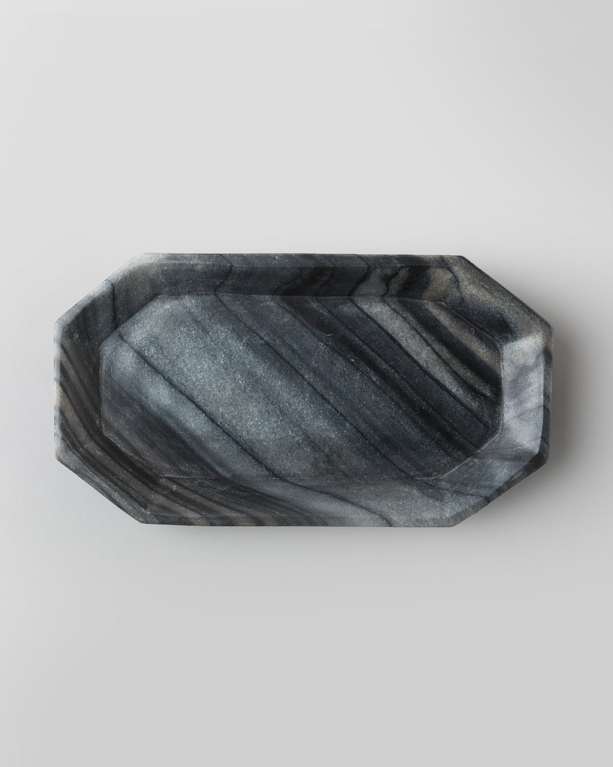 Overhead view of the black Bagua Tray showing its faceted rim.