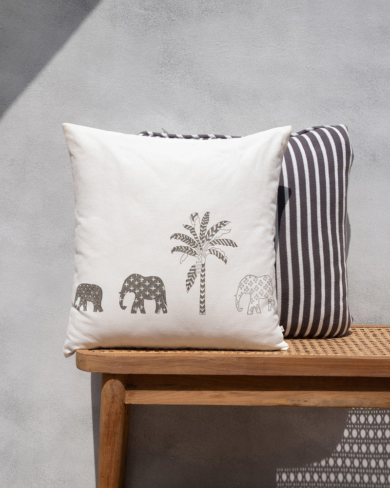 Ele Palm Cushion Cover in cream with a brown palm tree and three elephants.