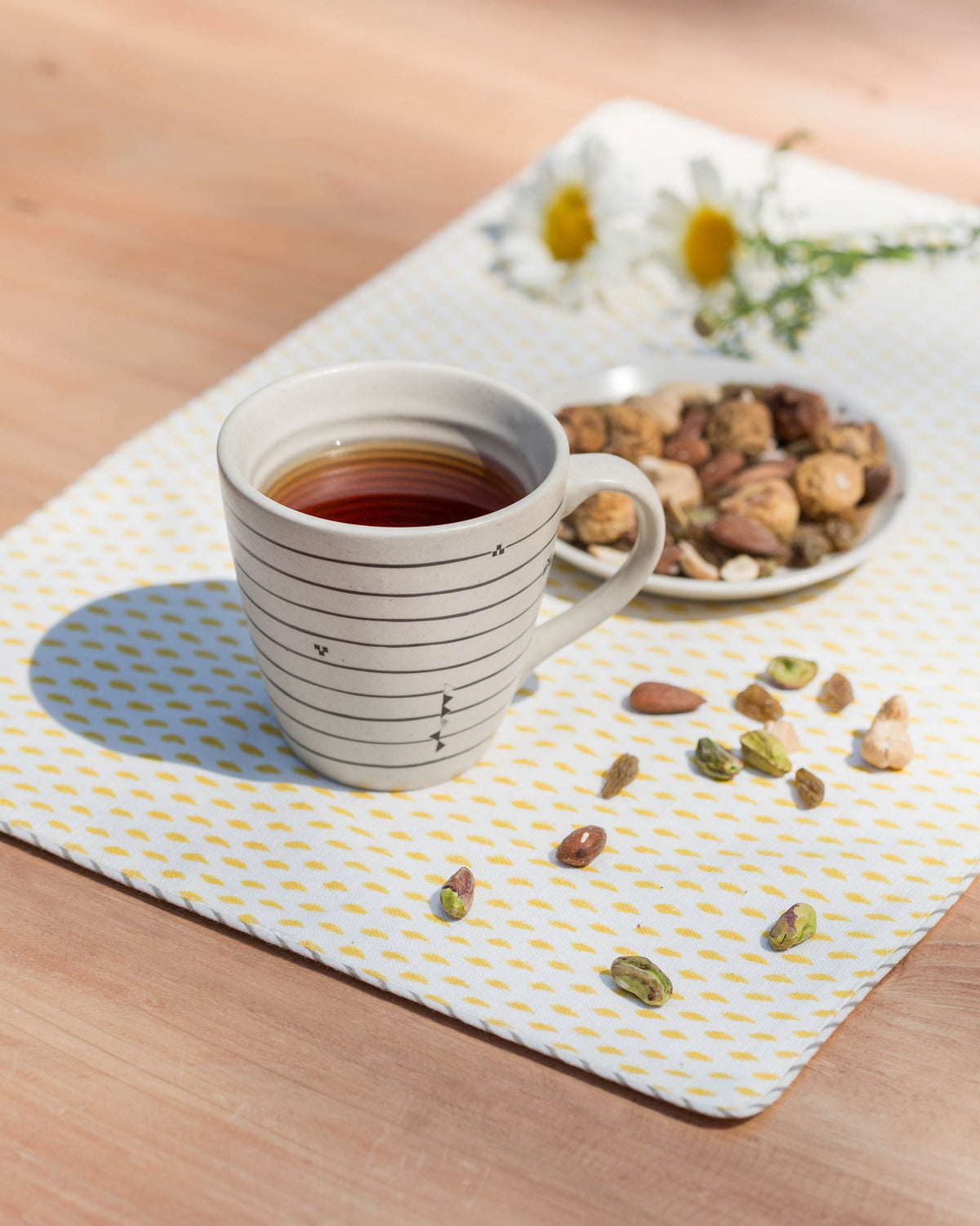 Ceylon conical mug filled with tea.