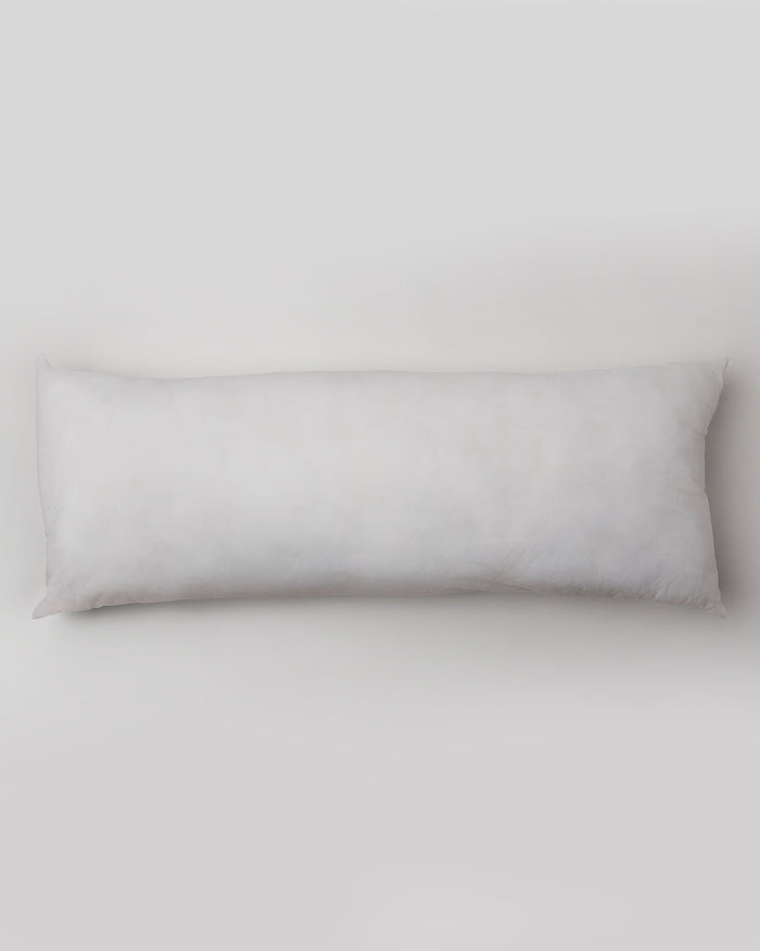 Overhead view of a long white Pillow Filler 36 x 91 cm.