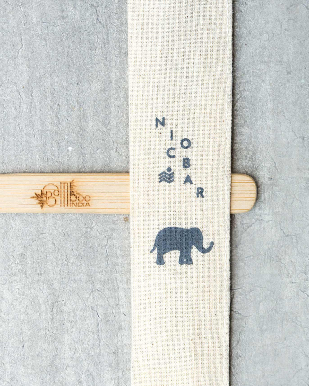 Close-up of a cotton pouch printed with a grey elephant.
