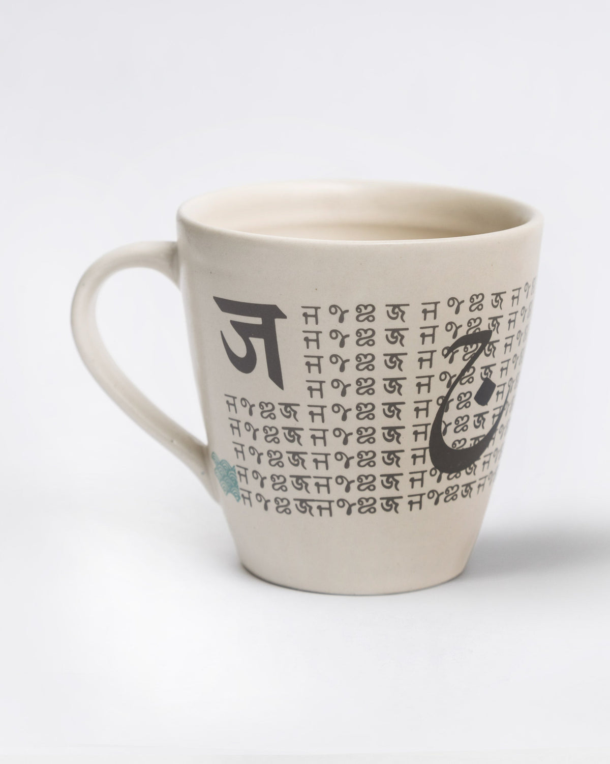 Side view of Alphabet J Mug with rows of small lettering on the other side.