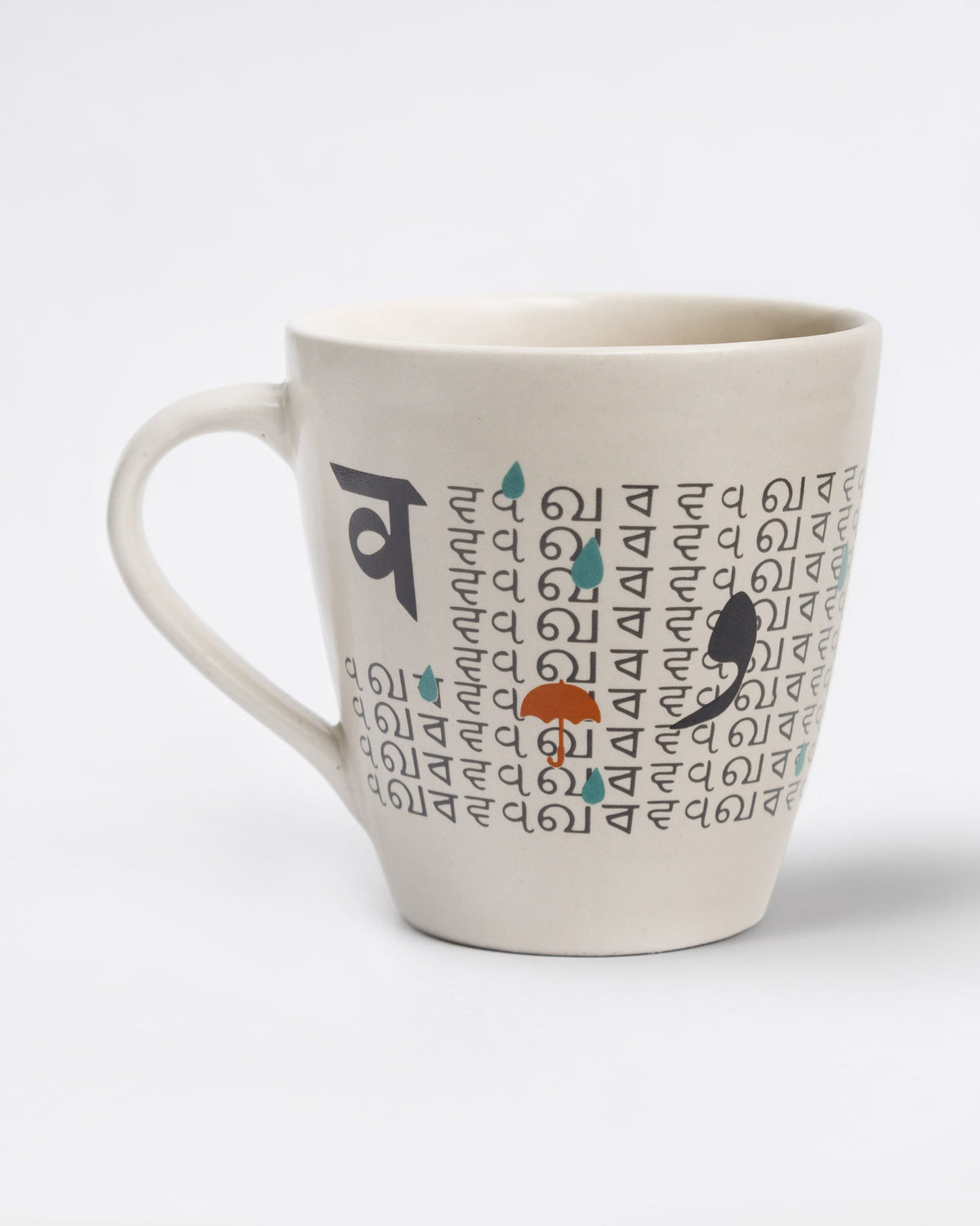 Alphabet V Mug showing repeated script lettering, an umbrella and raindrops.