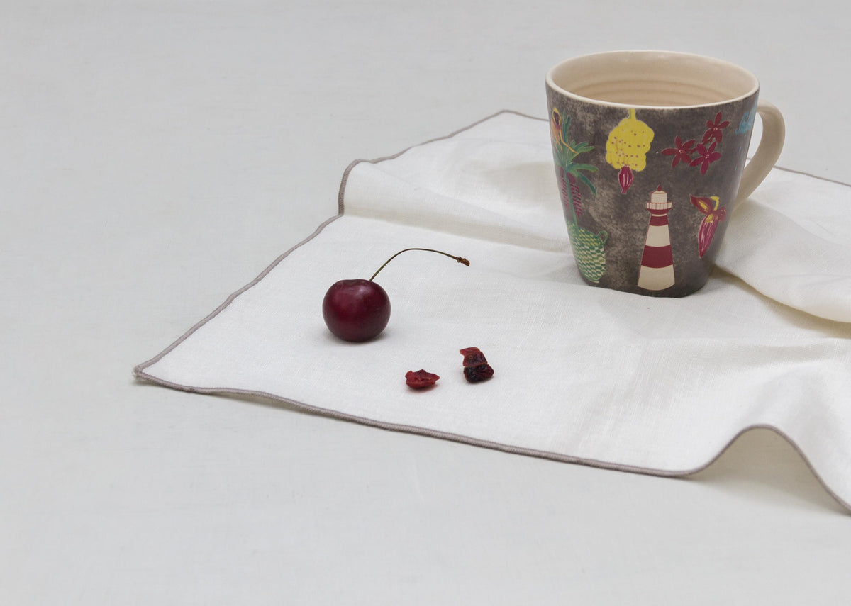 Paradisaya Conical Mug on a white napkin.