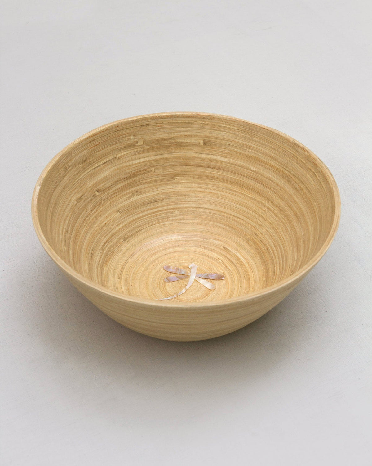 Close-up of the Bamboo Salad Bowl interior showing a small pale inlay.