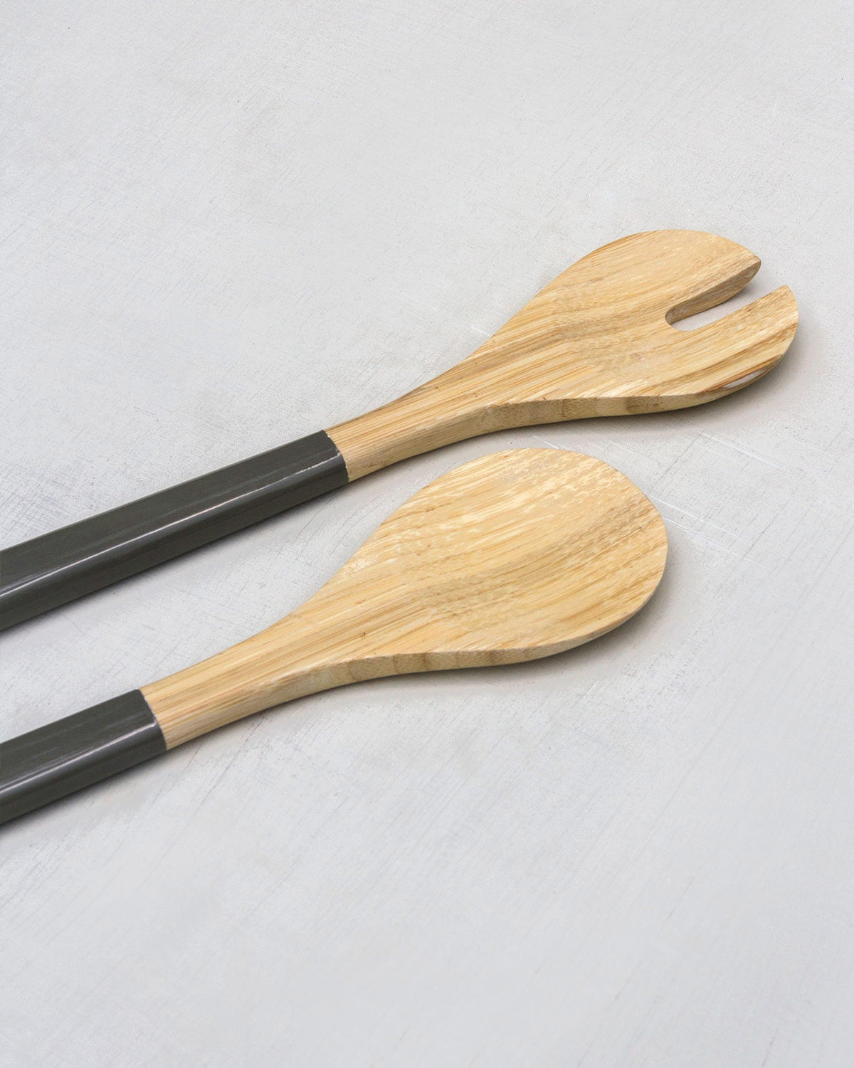 Close-up of the Bamboo Spoons showing grey handles and pale bamboo heads.