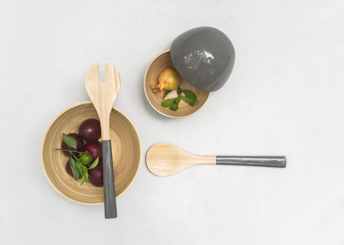Overhead view of the Bamboo Spoons with grey handles on a white surface.